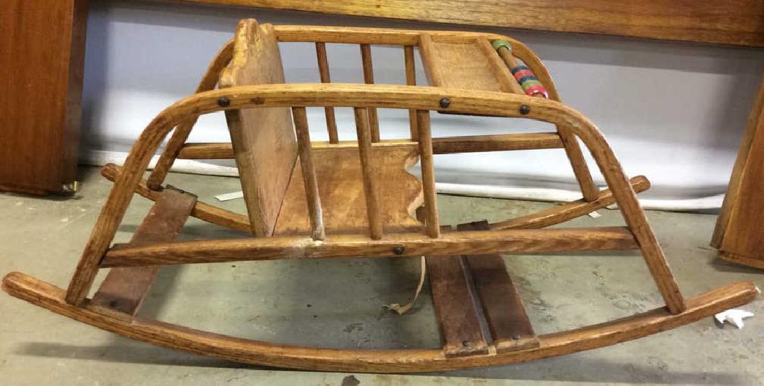 Delphos Bentwood Child's Rocker Toy: Vintage wood Rocking toy with attached colored wood beads and inset chair with strap. Labeled for Delphos Bending Company, Delphos, Ohio, made in USA , manufacturer of Bent Wood Products. Vintage toy 