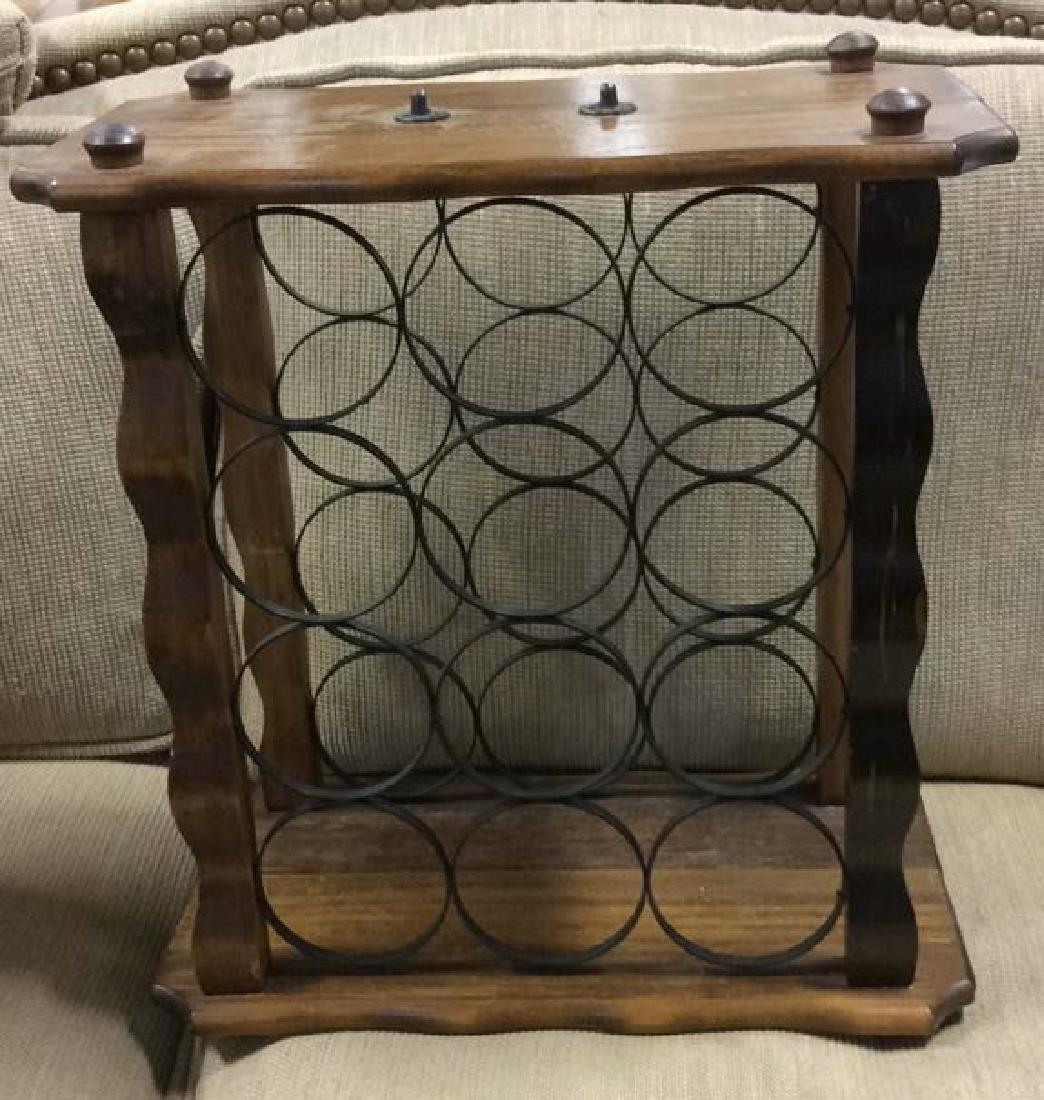 Wood and Metal Wine Rack: holds 12 bottles. carved wood frame. measures 18 by 17 by 9 inches