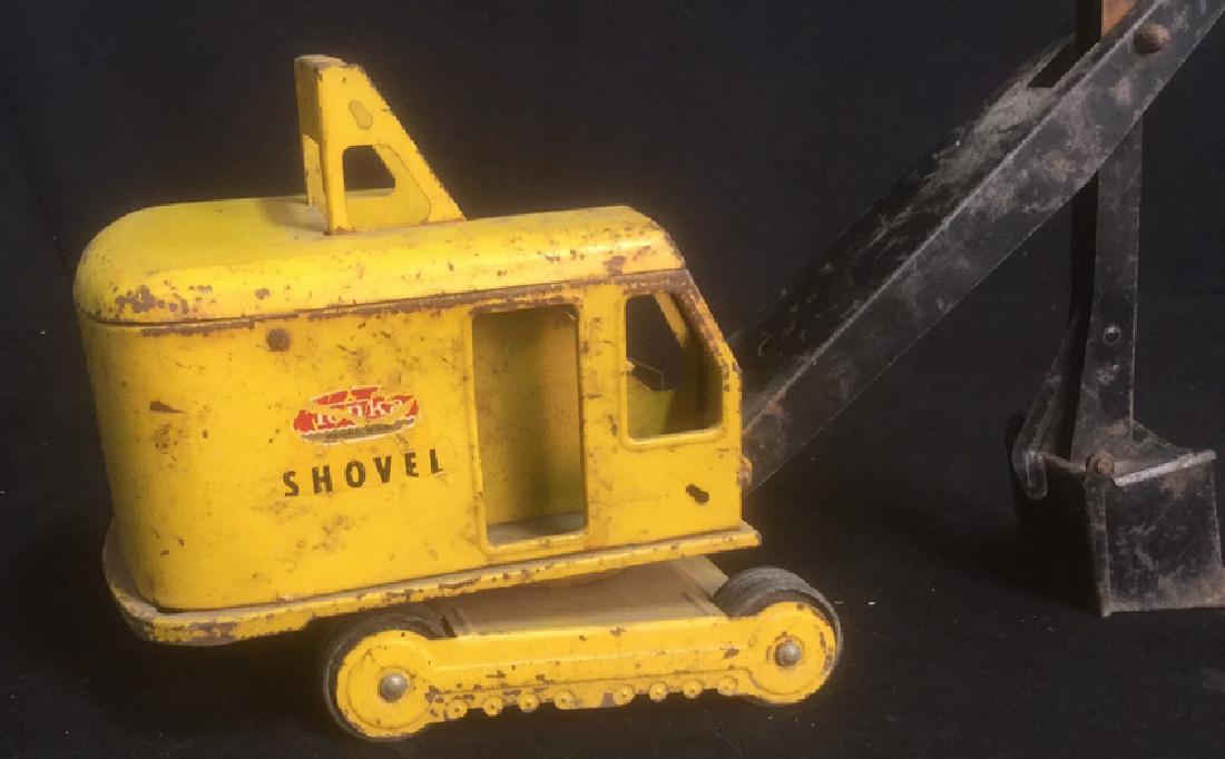 Vintage Steel Toy Tonka Tractor Bucket Shovel: Vintage pressed steel, toy tonka truck, tractor, bucket shovel. Measures approx 25 inches in length fully extended by approx 5 inches wide. Arm only is approx 16 inches long. Tonka Tractor Steel Vinta