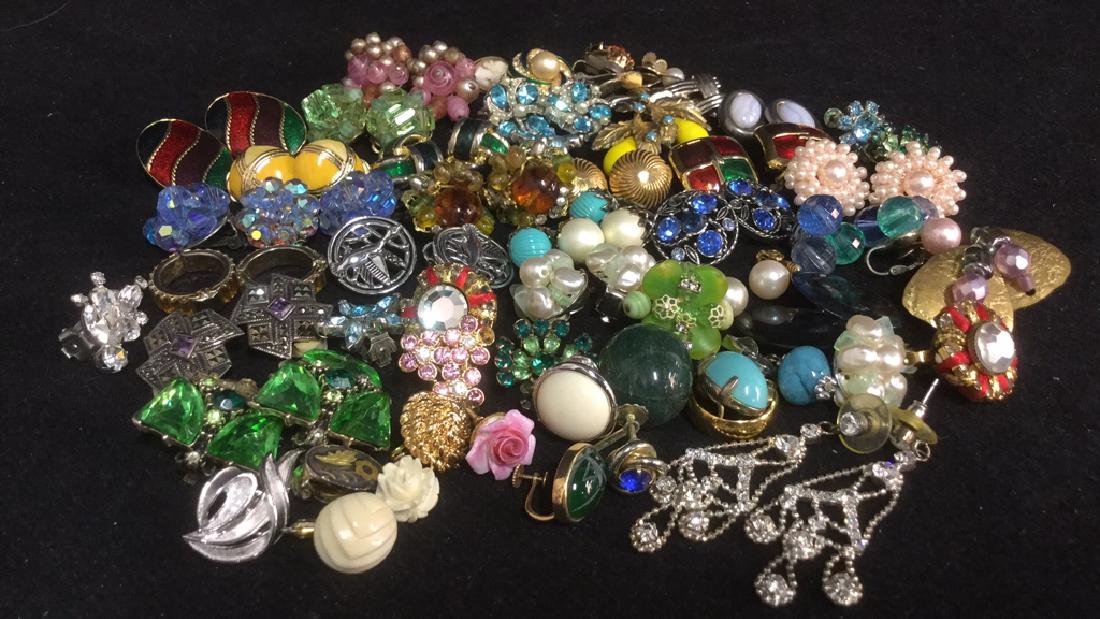 Group Lot Vintage Costume Jewelry Clip On Earrings: Group lot of Vintage Costume jewelry clip on earrings. Marked for Monet, Trifari, Denton England and more. There may be missing or lose parts.