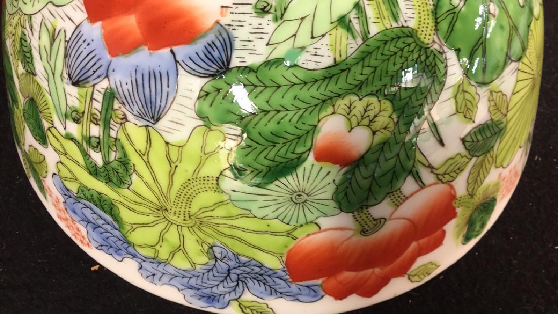 Two Porcelain Serving Pieces: 1 Ansley England oval serving dish marked B. Altman best bone china. Measures approx 10 inches L x 7 inches W. 1 serving bowl marked Japanese porcelain ware decorated in Hong Kong. Measures approx 8 i