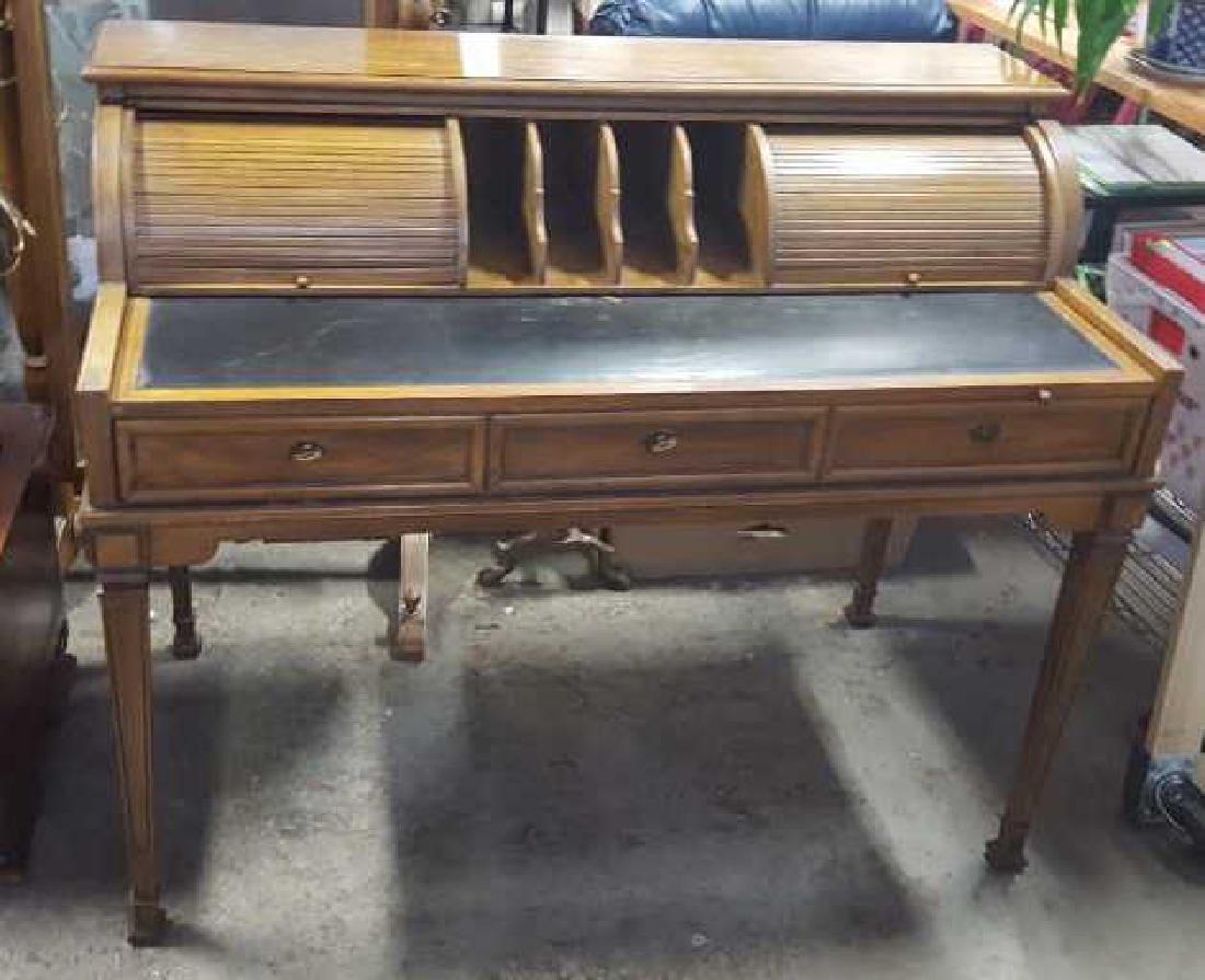 Thomasville Scroll Topped Desk: Thomasville Scroll Topped Desk, wood and leather, leather topped, two scroll shelves, straight legs, three drawers, leather top can be pulled out a few inches, brass hardware, one handle is missingn m