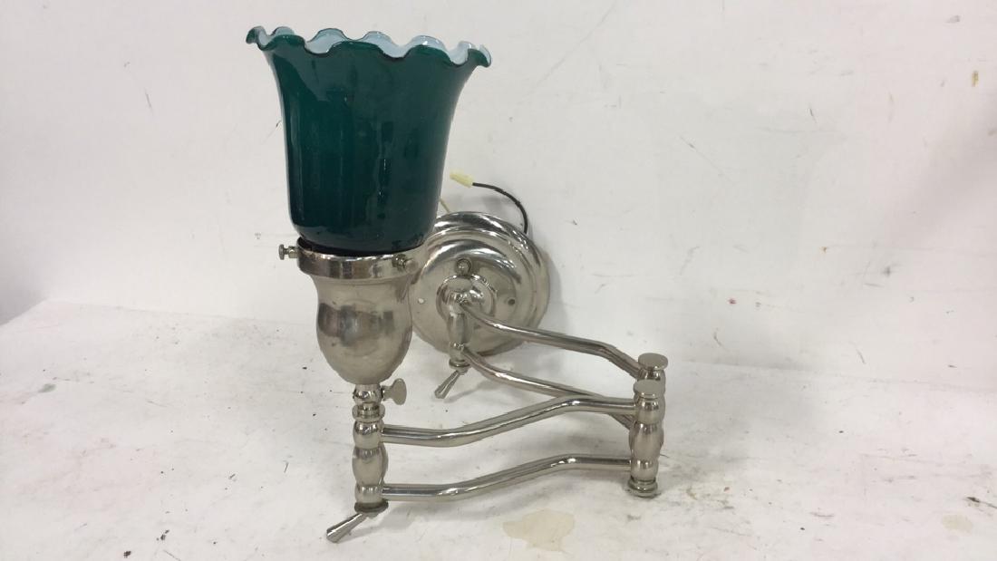 Swing Arm Glass Metal Wall Sconce: Swing arm wall sconce with metal arm and teal color glass. Measures approx 19 inches extended and 11 inches H. No condition issues noted.