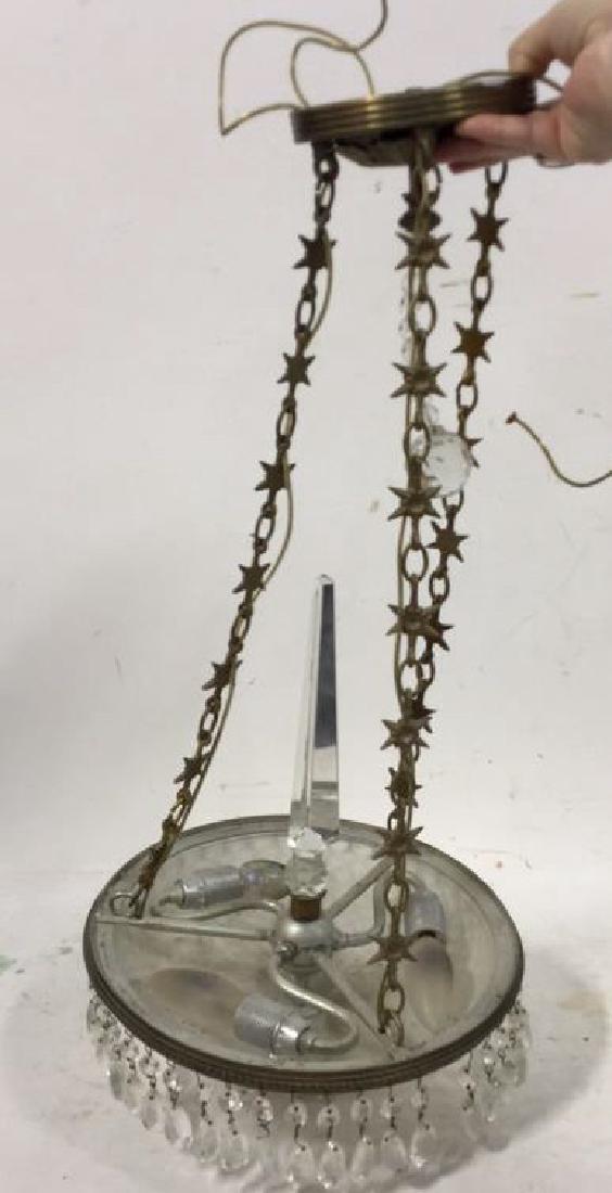 Vintage Glass And Brass Chandelier: 3 light chandelier with frosted glass shade and hanging glass pendants. Measures approx 25 inches long x 11 inches W. wear to brass consistent with age, otherwise no condition issues noted.