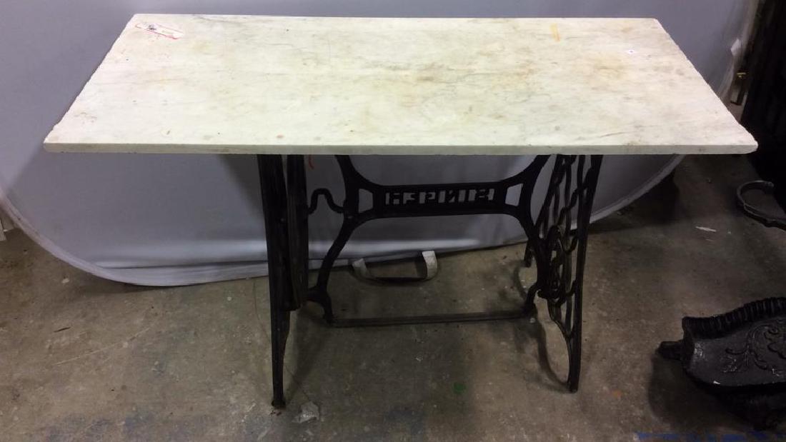 Antique Marble Topped Iron Singer Sewing Base: remade kitchen table, dining Table, desk, occasional table of white marble ogee edged top measuring 43 inches by 20.5 inches ht 30 inches. rests on antique iron base Singer Sewing Machine antique iron
