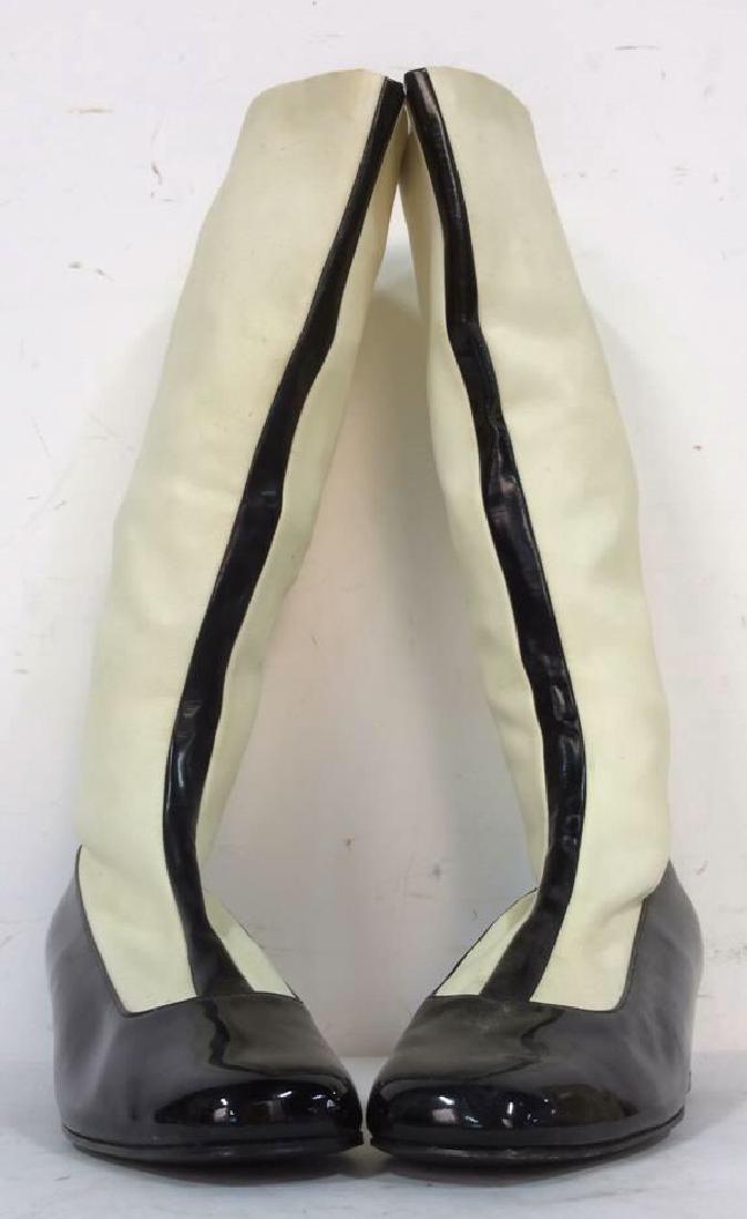 SAKS FIFTH AVENUE VIntage Spectator boots: SAKS FIFTH AVENUE Pair of Man made sole and stretch stocking boots. Balck white spectqtor style, measures approx 18 inches tall Right Label reads size 8 1/2, Left label reads size 9. Property of Green