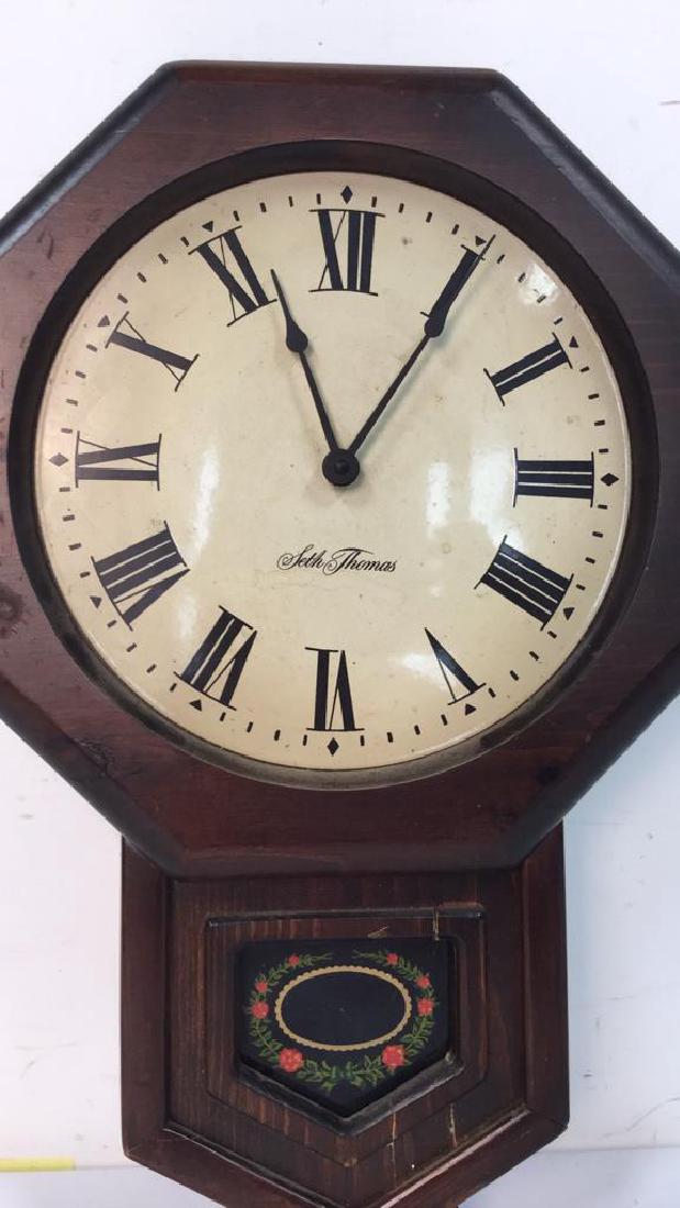 Seth Thomas Wooden Wall Clock: Seth Thomas Wooden Wall Clock without glass. Measures 20 inches high 14 inches wide. Minor surface cracks. Otherwise, no other condition issues noted.