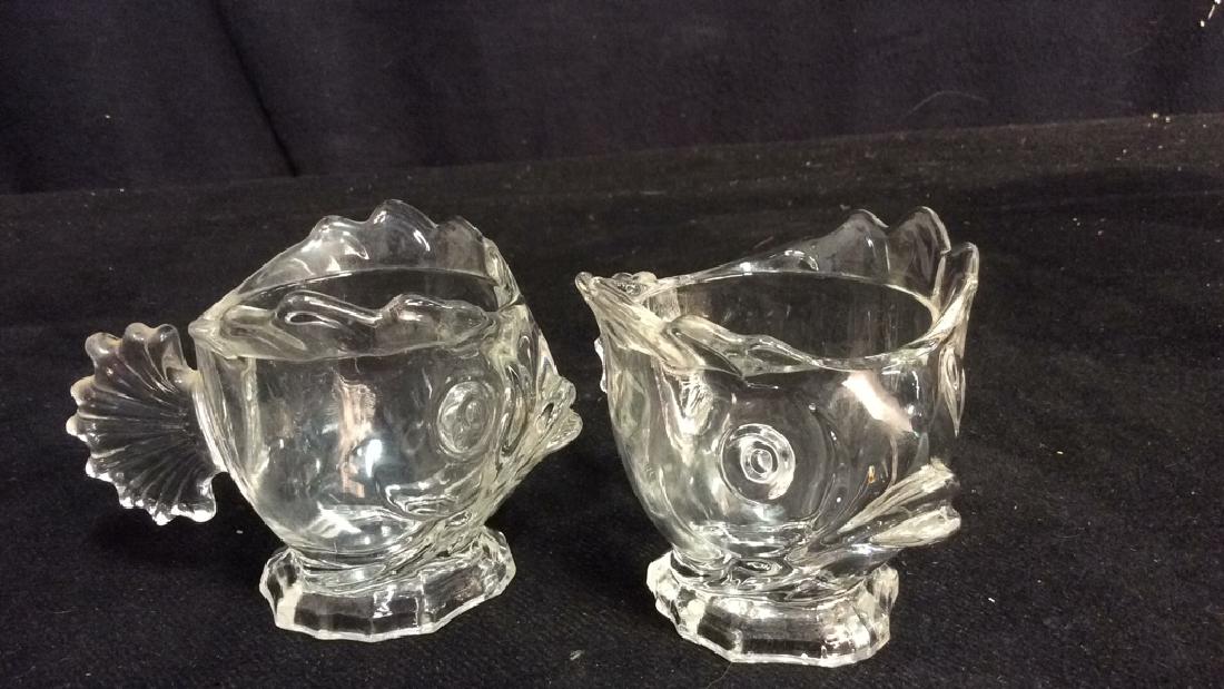 Pair Vintage Whimsical Glass Fish: Two Vintage whimsical glass fish cups, creamers, sugars or trinket table tops. Each measures approx 3 1/2 inches high by 4 1/2 inches wide.
