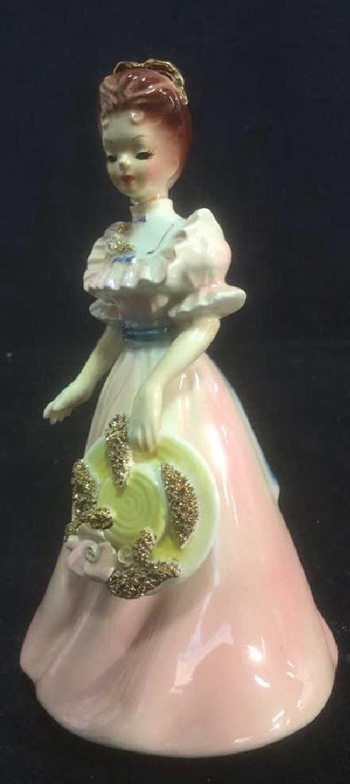 Porcelain Hand Painted Country Female Figurine: signed illegibly on underside, measures approx 7 1/4 inches tall. Property of Greenwich and Palm Beach estate.