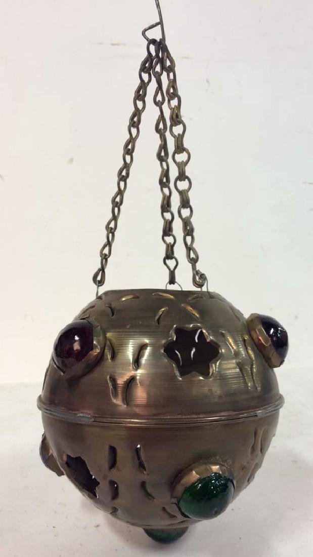 Chain Suspended Religious Ceremonial Thurible: Thurible contains star cut outs and multi colored glass orb inserts. Measures approx 15 inches tall 7 inches wide.