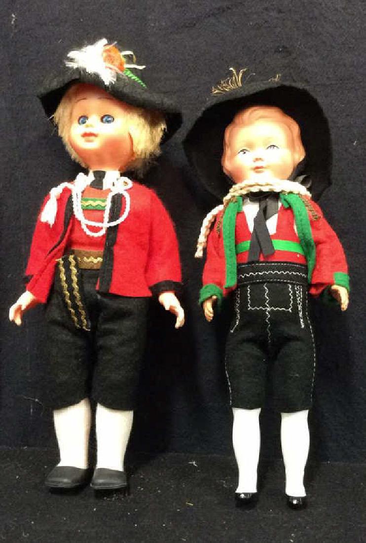2 Bavarian Dressed Collectible Dolls: Both made of plastic, larger doll measures approx 10 inches tall 4 inches wide.