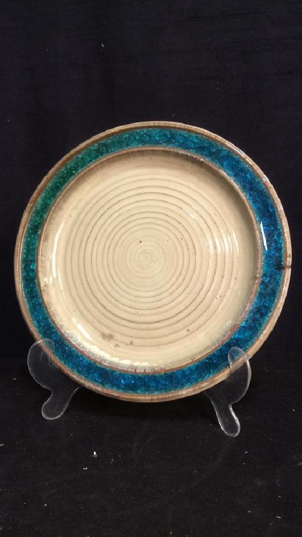 DESIGN TECHNICS Glazed Ceramic Plate: Marked for Design Technics on underside, glazed ceramic plate with blue gem form border. Measures approx 13 inches diameter.