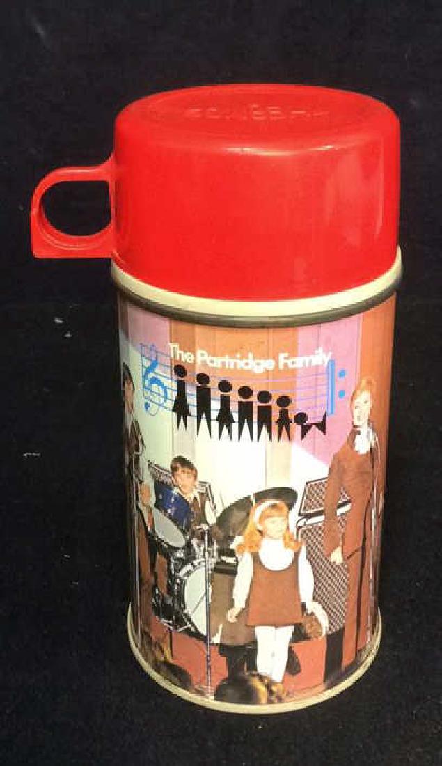 Vintage 'The Partridge Family' Collectible Thermos: Marked for Thermos, marked for half pint size, collectible, The Partridge Family Thermos. Measures approx 6.5 inches tall and 3 inch diameter.