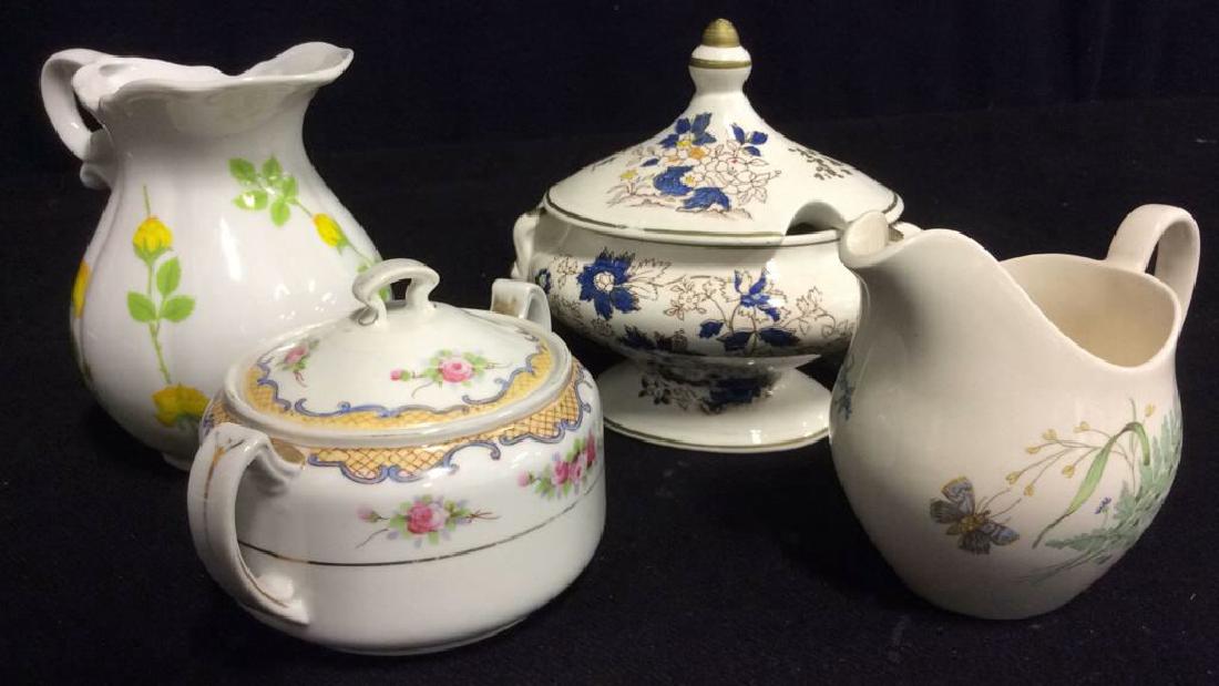 Lot 4 Creamer & Sugar: Butterfly leaf & vine creamer marked JOHNSON BROS. Blue floral detailed sugar marked ROYAL CROWN. Pink floral detail creamer marked NIPPON. Yellow floral and Vine detail creamer unmarked