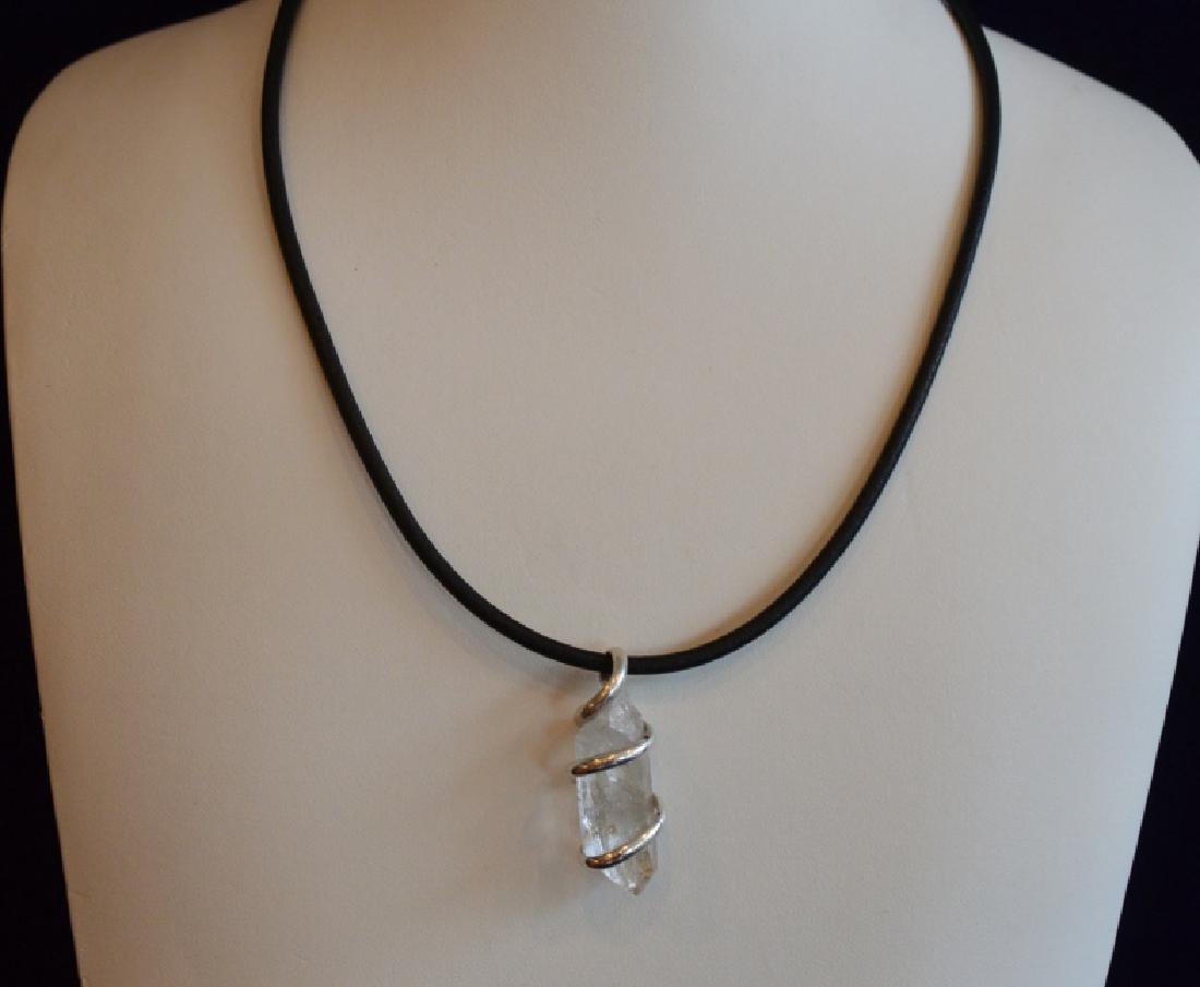 Ladies 16" Natural Quartz Choker Style Necklace: Clear quartz surrounded by sterling silver on 16" faux leather rope. Natural quartz is believed to enhance healing, improve awareness and reduce stress
