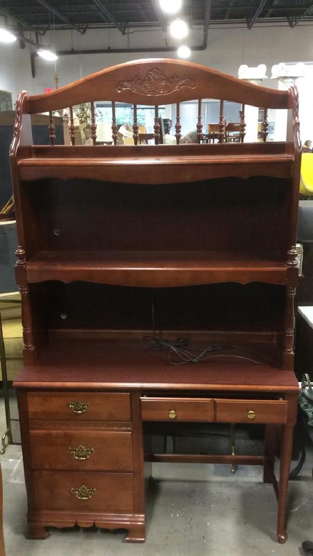 STANLEY FURNITURE Wooden Desk w Hutch: Marked for STANLEY FURNITURE. 4 drawer desk w 2 shelves. Gold toned drawer handles. Carved wood. detail. Measures approx 45 inches long 81 inches tall 18 inches deep.