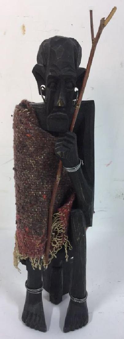 Hand Carved Besmo Statuette: Marked for genuine besmo, hand carved statuette of elderly tribal man. Measures approx 9 inches tall and 2 inches wide.