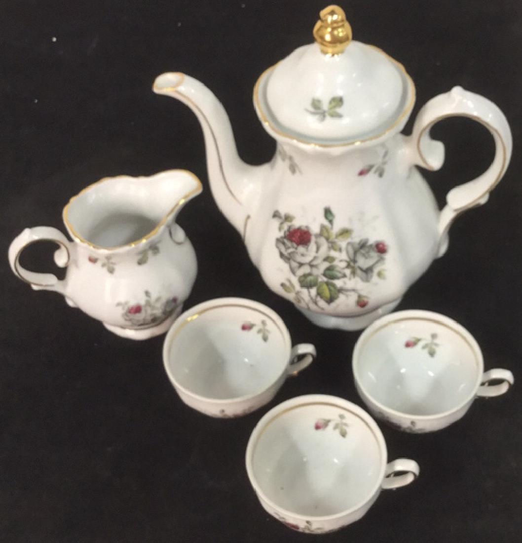 Lot 5 Bavarian China Teapot Creamer Cups: Includes 3 cups, one creamer, 1 teapot which measures approx 8 1/2 inches tall by 7 inches wide. All marked for Winterling Finest Bavarian China Made in Germany.