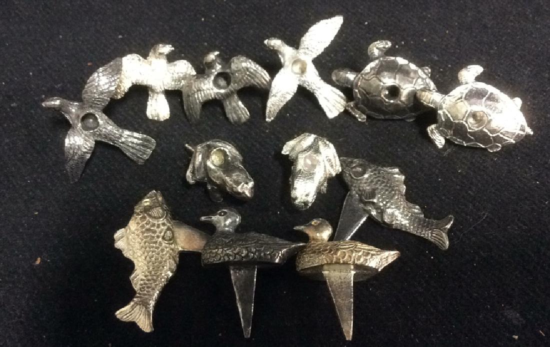12 Vintage Bird Frog Fish Silver Plate Table Decor: vintage pie birds, food markers, table top decor, hors doevres tooth picks, cheese markers, place setting markers. with small holes at top possibly birthday cake candle holders, sculpted forms of fish
