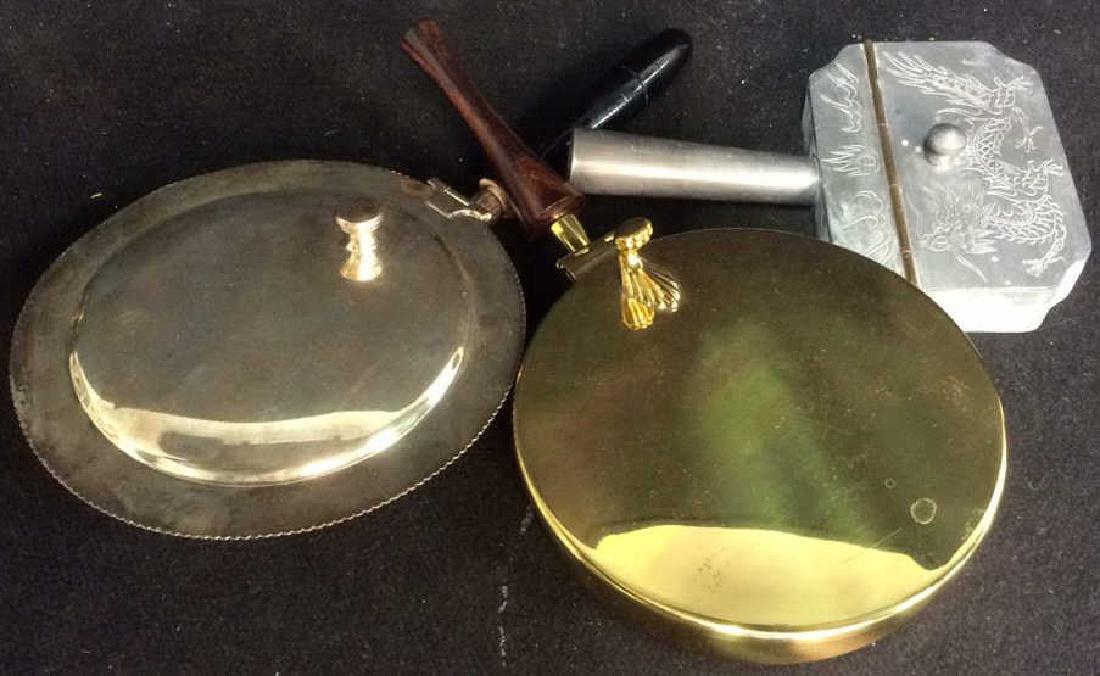 3 Silent Butler Trays: vintage possibly antique, one silver plate with ebony wood handle, one brass itch sleek wood handles marked for Italy, one metal marked made in Hong Kong with etched dragon design, length of largest a