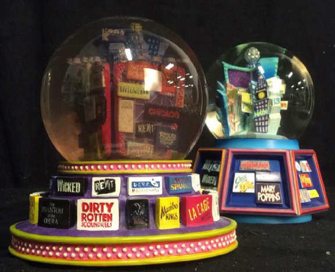 2 Musicals Collectible Snow Globes: 2 Musicals Collectible Snow Globes both measure approx 7 inches tall 6 inches wide. Property of Manhattan estate.