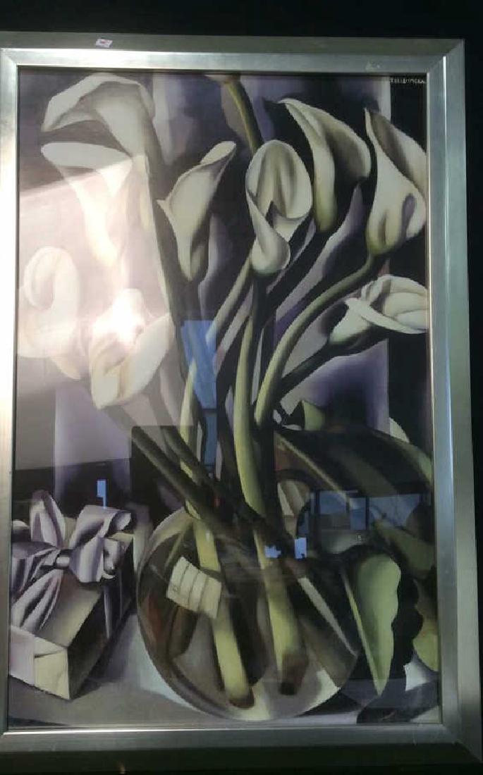 Framed Artwork Calla Lillies By T. de Lempicka: Calla lillies in vase, Art Deco, framed artwork by Tamara de Lempicka. Silver colored frame with some scratches visible. Measures approx 38.5 inches H x 26 inches W. Property of Chappaqua Estate