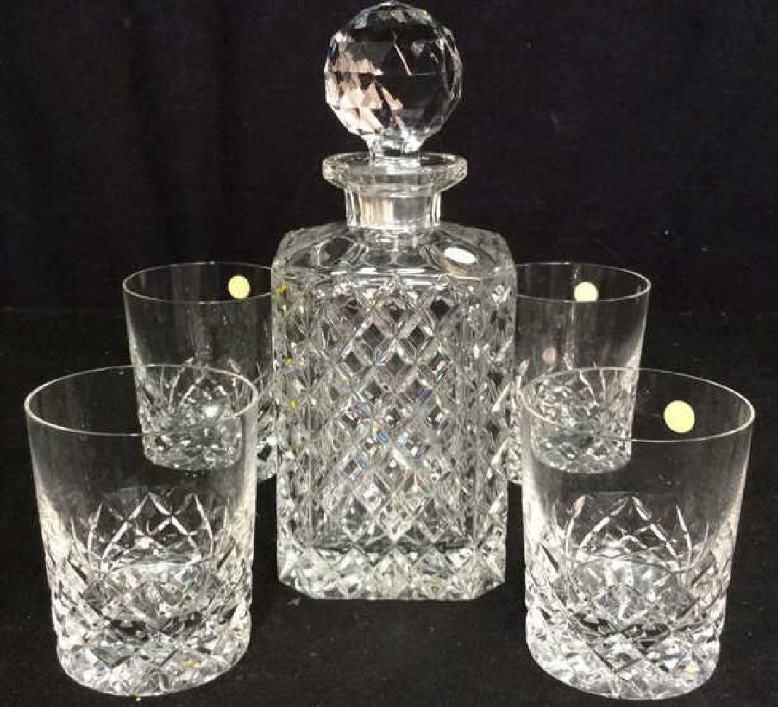 Lot 5 Hand Made Ceská Crystal Decanter Set: Includes 4 glasses & Decanter w faceted stopper. Marked for Hand Made Ceská Czechoslovakia. Decanter measures approx 10 inches tall 4 inches wide. Cups measure approx 4 inches all and 3 inches wide.