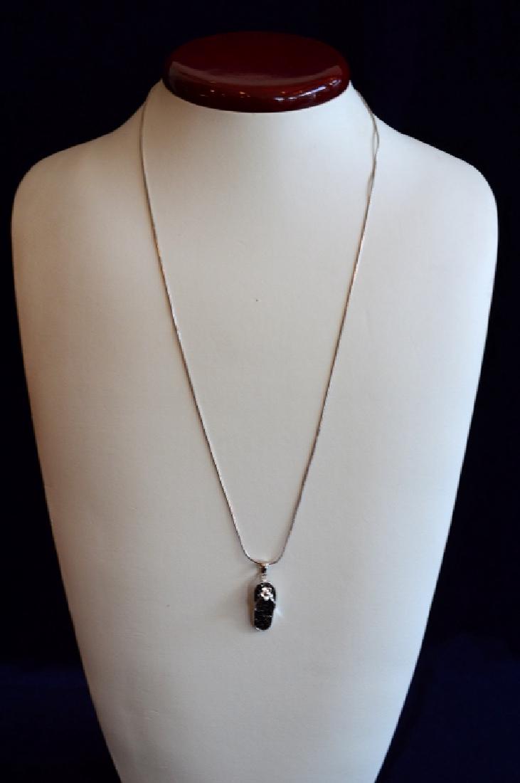 22" Sterling Silver Necklace with Sandal Charm: Made of .925 Sterling Silver, 22" long snake chain w lobster clasp. Charm is 1 1/8" long in silver with black stones, 4.0 dwt