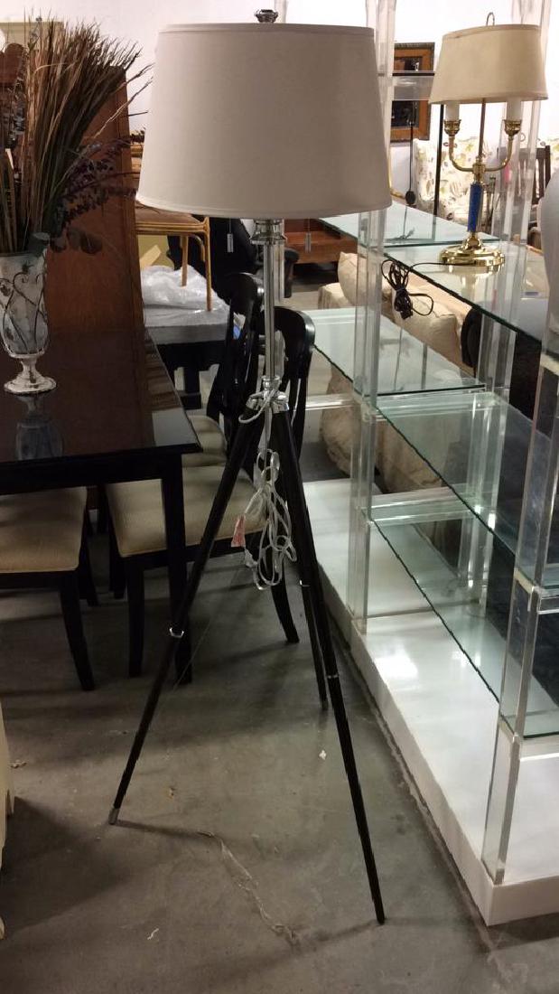 Contemporary Ebony Wood & Chrome Tripod Lamp: Ebony Toned Wood & Metal Tripod Floor Lamp, Ability to adjust height. Includes finial. One leg is missing metal end piece. Otherwise no other condition issues noted, measures approx 69 inches tall, 30