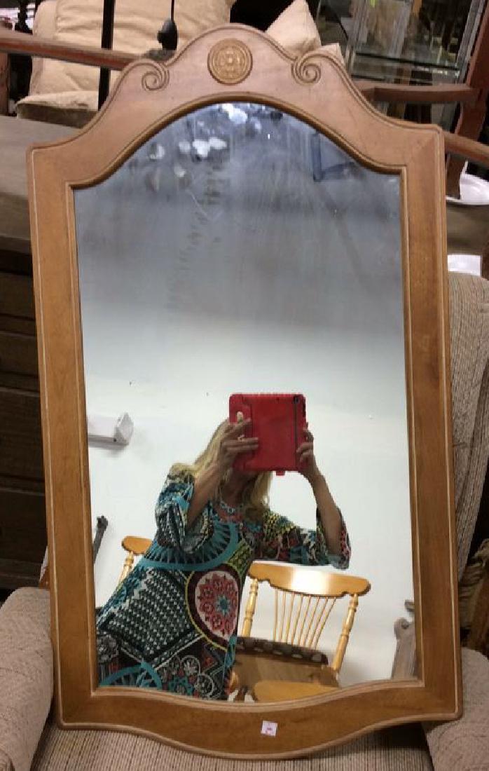 Ethan Allen Carved Wood Wall Mirror: carved wood vintage mirror with center medallion. measures 39 by 22 inches. marked Ethan Allen Made in America. made in USA