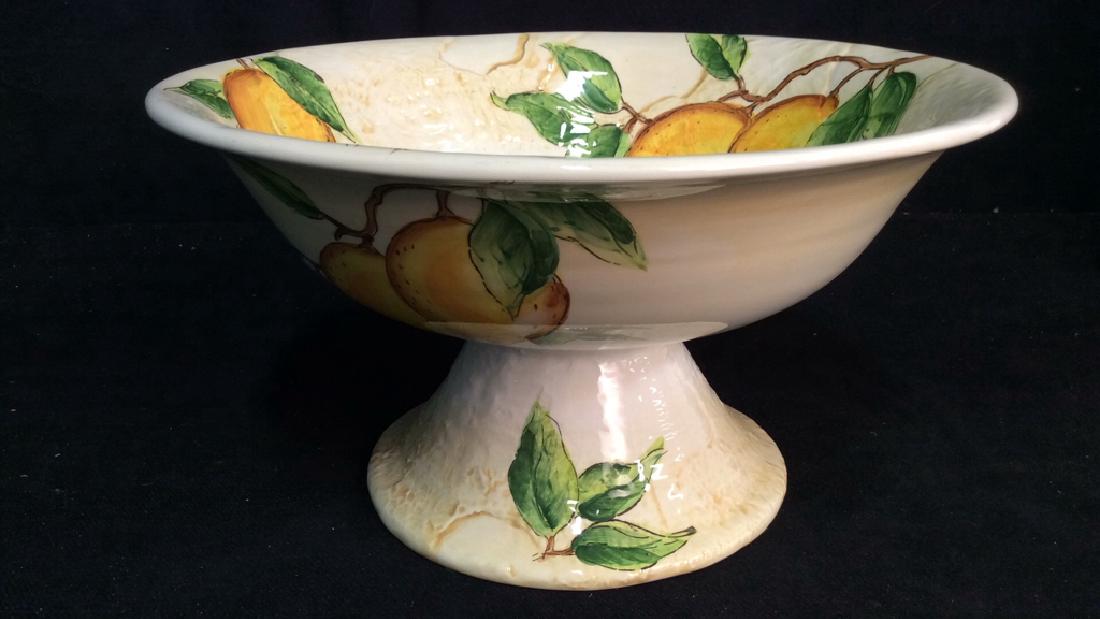 Porcelain/Ceramic Fruit Bowl On Stand: Porcelain/Ceramic Fruit Bowl on Strand w painted Lemons/green leaves and branches. No condition issues noted. Measures approx 13 inches diameter and 4 inches deep bowl. The built in stand with bowl me