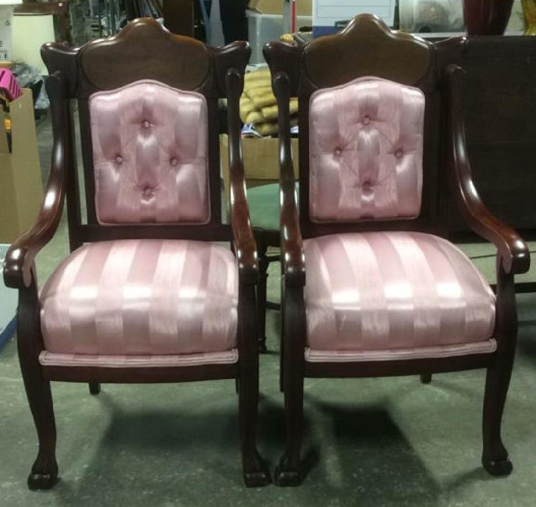 Pair Carved Mahogany Upholstered Armchairs: Pair of Carved Mahogany Armchairs, carved back in art Nouveau style, with inlayed walnut medallion. Upholstered in striped tone in tone pink silk, scrolled arms, claw feet, good condition. Property of