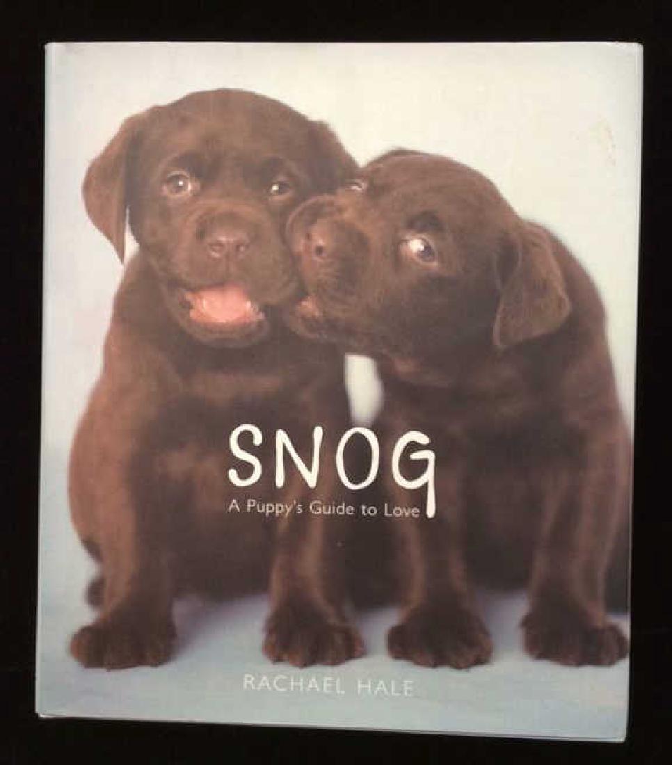 Book Snog: A Puppy’s Guide to Love: Snog: A Puppy’s Guide to Love by Rachael Hale, published by Hackett Book Group. A series of animal portraits focusing on puppies paired with quotes about love and relationships. Book measures approx