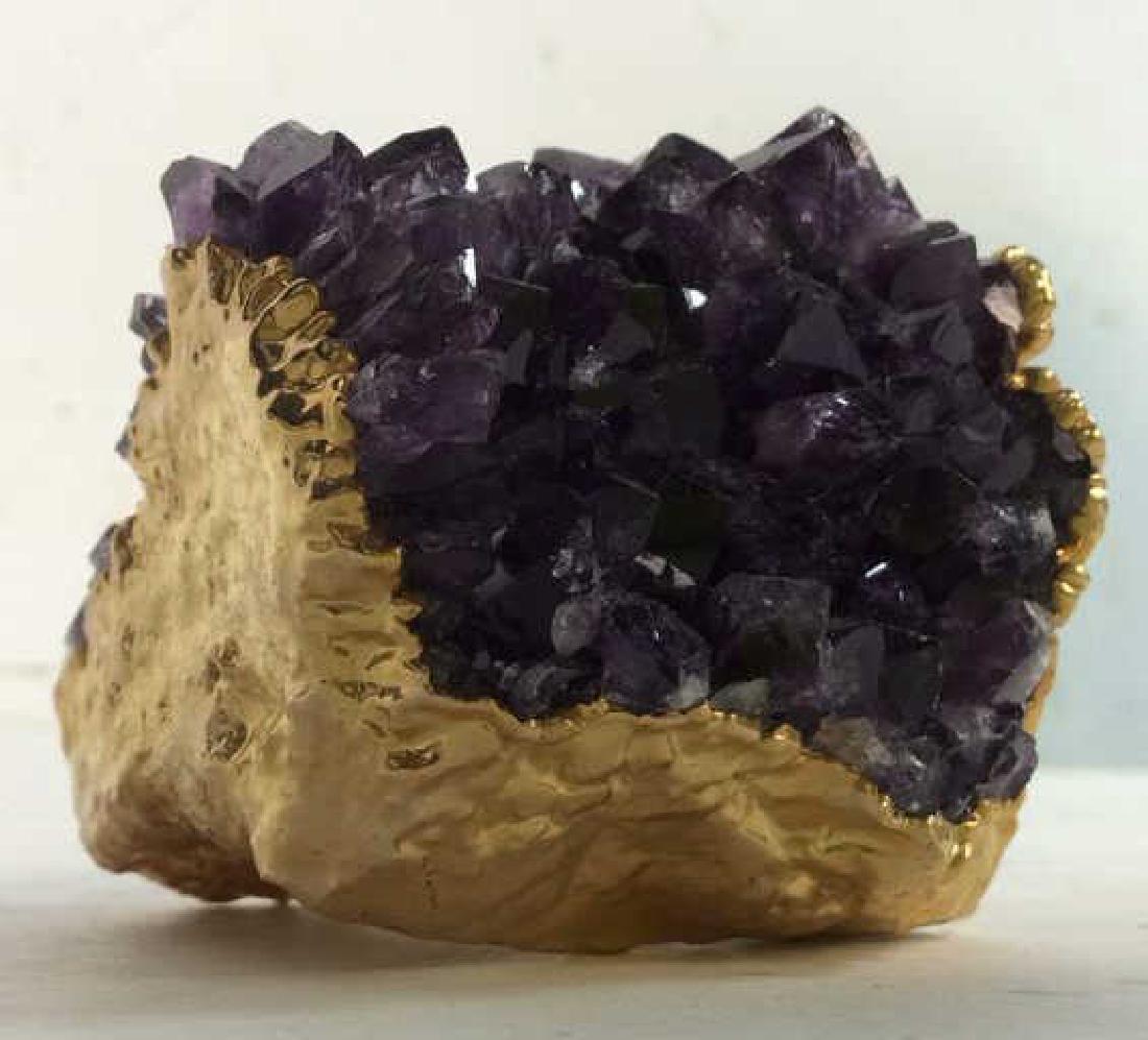 Gold Toned Painted & Amethyst Geode: Gold Toned Painted Geode with violet stones. Measures approximately 2 inches tall and wide.