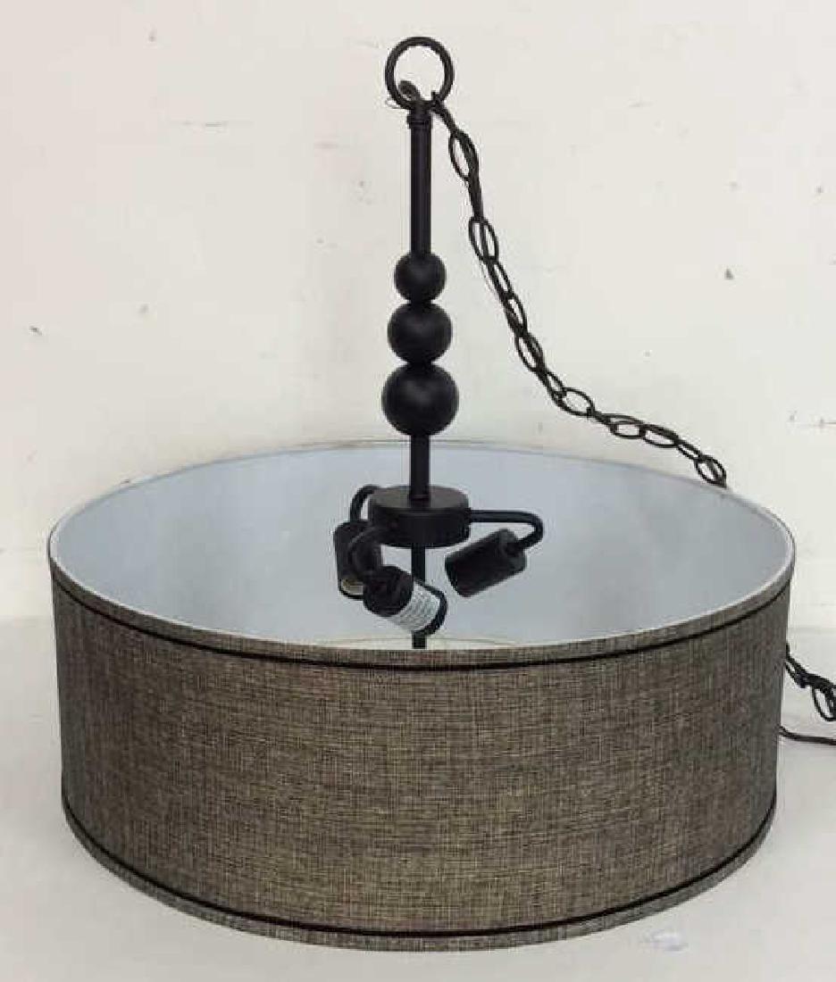 Hanging Black Fabric Drum Chandelier: Hanging Black Chandelier Light Fixture. Fabric Centerpiece light fixture, oversized fabric drum shade Three bulbed light fixture with orb decorations. Measures approx 20 in tall by 8 in wide without l