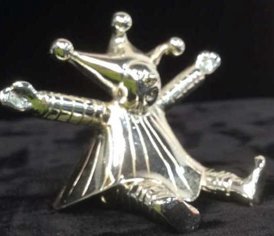 Christofle France Silver Court Jester Figural: seated court jester with three Bell hat marked Underside for Christofle, made in France, and trademarked: purchased from Christofle New York City . good condition, measures app ht 2 inches width 2.5 i