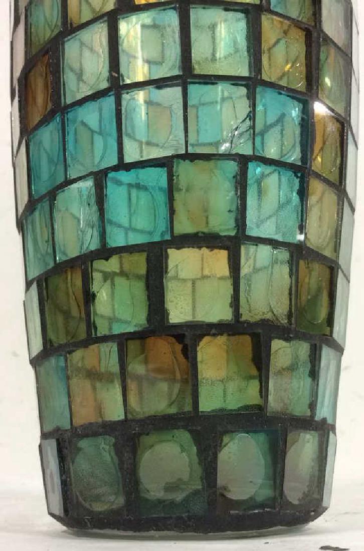 Multi-toned Mosaic Glass Vase: Colored Glass Hand Crafted Mosaic Vase,Multi-toned Glass Vase. Contains sea blue and orange tones. Some portions of glass are fractured. Measures approx 16 inches tall 4.5 inches wide.