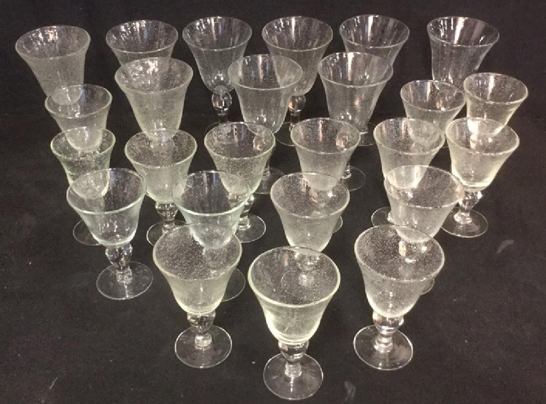 Lot 25 Clear Bubble Glass Goblets: Lot 25 Clear Bubble Glass Goblets. Nine XLarge goblets and sixteen medium sized goblets. Clear glass stems with bubble glass goblets. Festive barware. Holiday entertaining. No condition issues noted. 