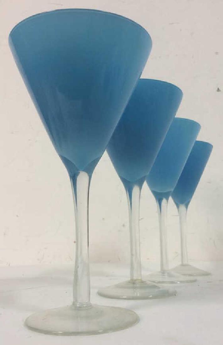 Lot 4 Sky Blue Tone Cocktail Glasses: 4 Sky Blue Tone Cocktail Glasses. Blue beverage glasses, blue cocktail glasses, Matte blue cocktail glasses. Each measures approx 8 inches tall 4 inches diameter.