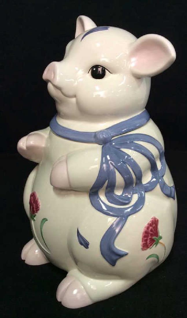 LENOX POPPIES ON BLUE Pig Statuette Cookie Jar: LENOX POPPIES ON BLUE Pig Statuette Cookie Jar. White toned porcelain pig statuette with raised and textured floral design and ribbon detail. Marked on bottom as being LENOX POPPIES ON BLUE. Measures