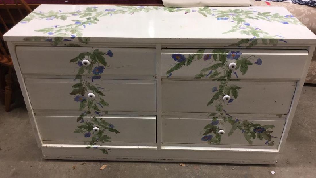JOHNSON CARPER Floral Detailed Dresser: Marked JOHNSON CARPER. Wooden Dresser. Contains 6 drawers, floral and leaf detail possibly hand painted, Knob style handles. Floral dresser, bedroom furniture, painted dresser, white dresser, wooden d
