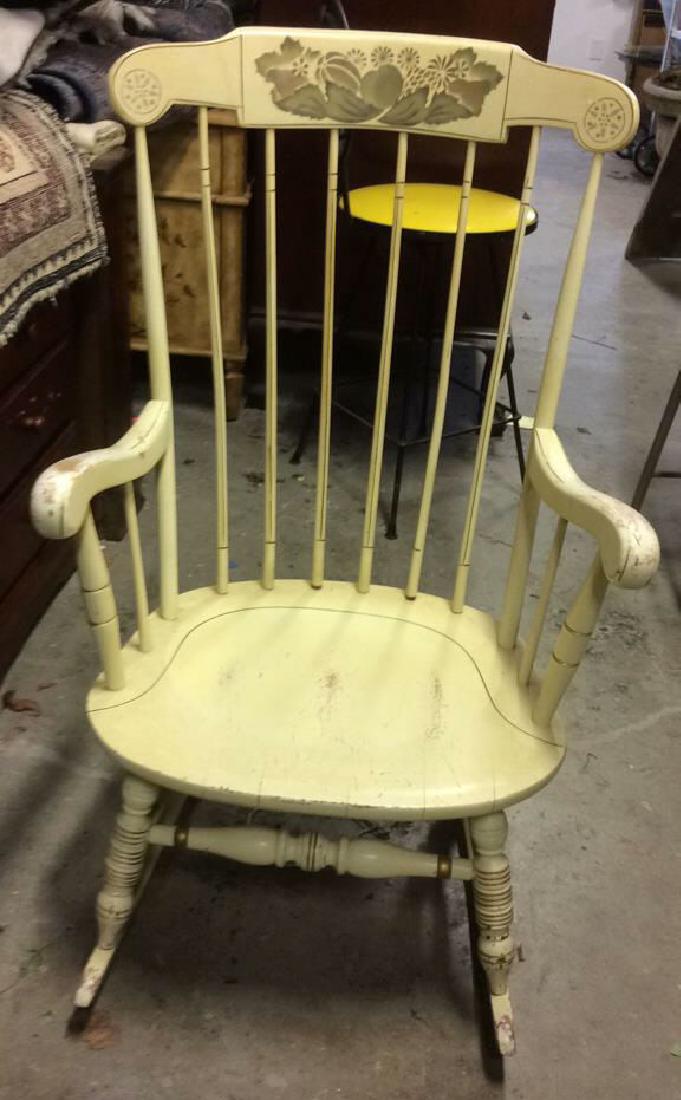Wooden Light Green Toned Rocking Chair: Wooden Light Green Toned Rocking Chair. Appears to be vintage. Contains Painted floral and leaf detail on top of backrest. Spindle shaped backrest. Contains paint wear, some spindles are somewhat loos