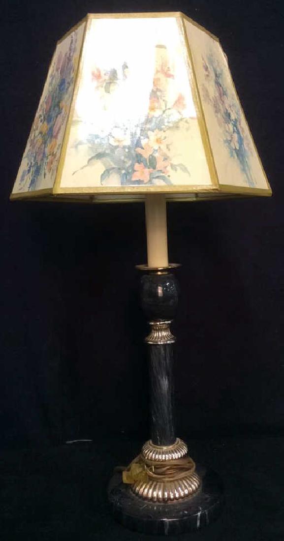 Marble Body Lamp With Floral Detailed Shade: Contains black toned body which appears to be marble. Shade contains floral detail with tones of pink, light blue, yellow, white, purple and green. Shade clips on to light bulb. Some minor tears prese