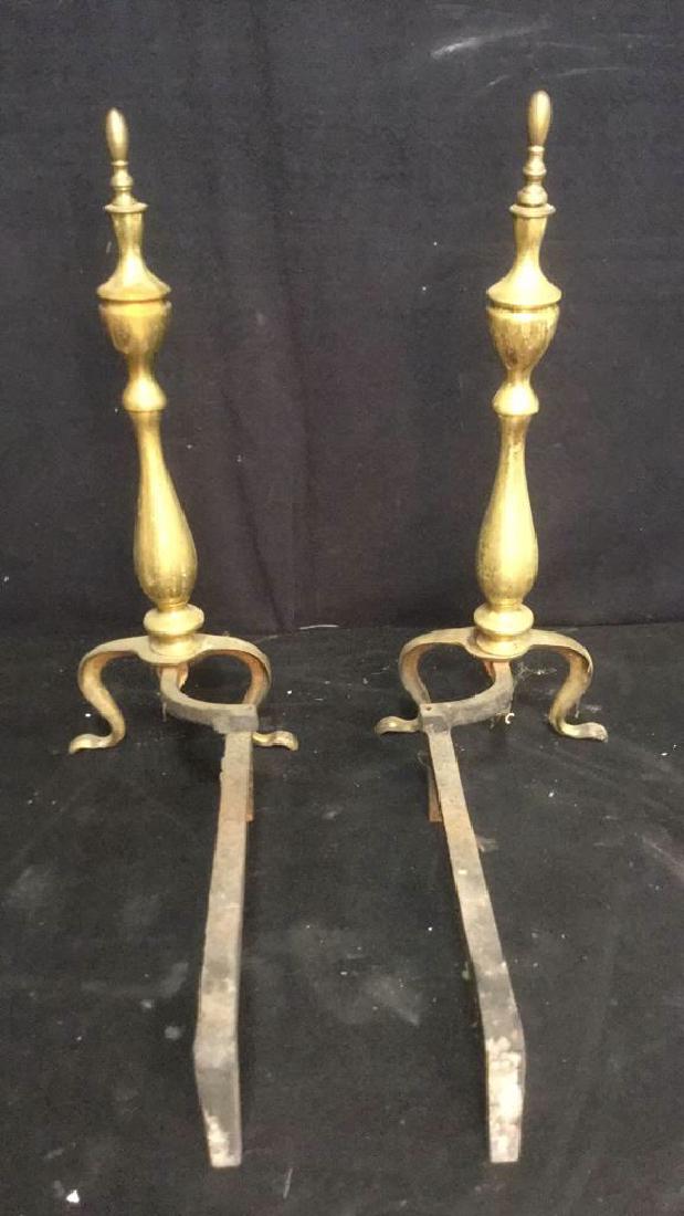 Vintage Gold Toned Brass Andirons: Vintage possibly antique Gold Toned Brass Andirons. Some wear due to age. Each measures approx 20 inches tall 20 inches long including stand.
