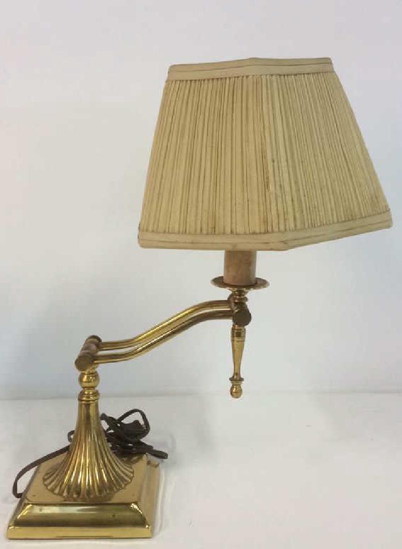 Gold Toned Kinked Arm Lamp W Shade: Gold Toned Kinked Arm Lamp W Shade. Lamp is metal. Shade attached to light bulb. Lamp has not been tested. Measures approx 17 inches tall 10 inches wide without shade.