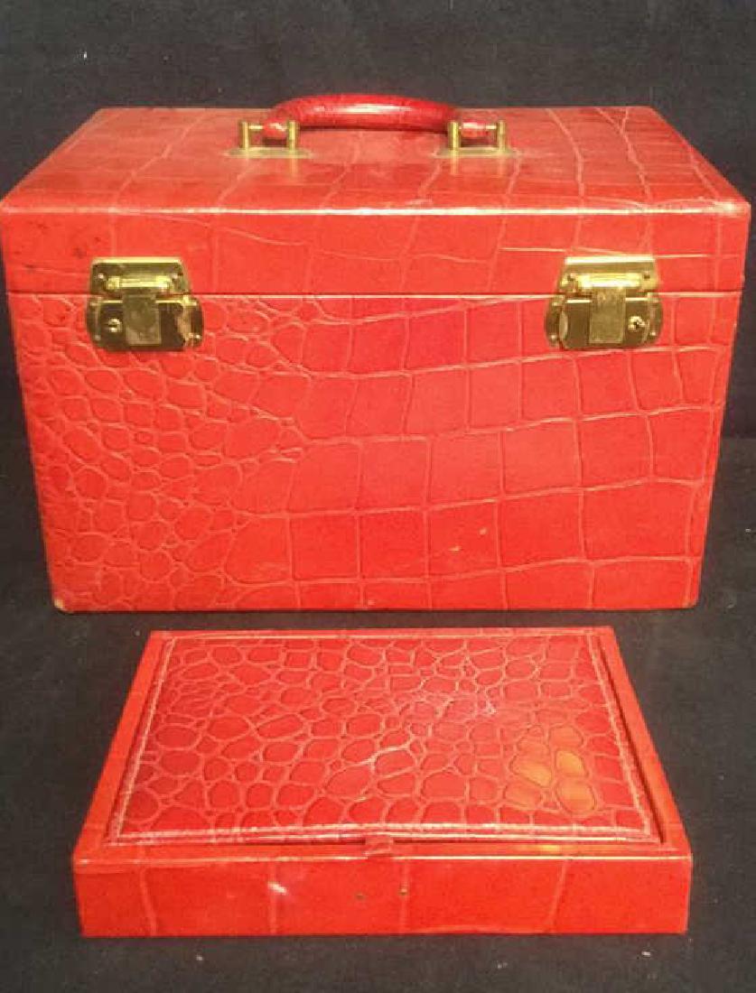 Lot 2 VOGEL Train Case & Trinket Box: Marked LUXURY IN LEATHER BY VOGEL make up case and trinket box. Both box and case are red toned. Makeup case, trinket case, leather trinket box, Vogel trinket box, red toned trinket box. Larger piece