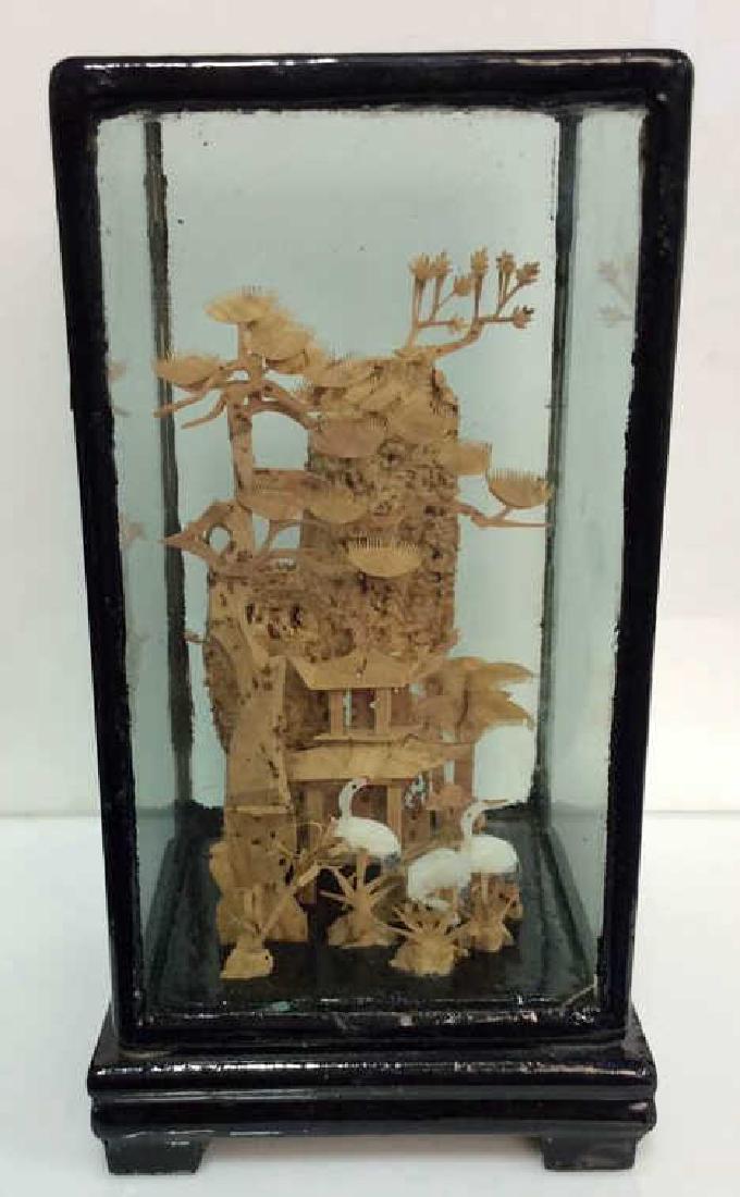 Chinese Art Sculpture: Chinese Art Sculpture. Cork sculpture of Chinese building in wooded landscape with storks. Dimensional cork sculpture in glass and lacquered wooden display box. Tag on bottom is marked with Chinese ch