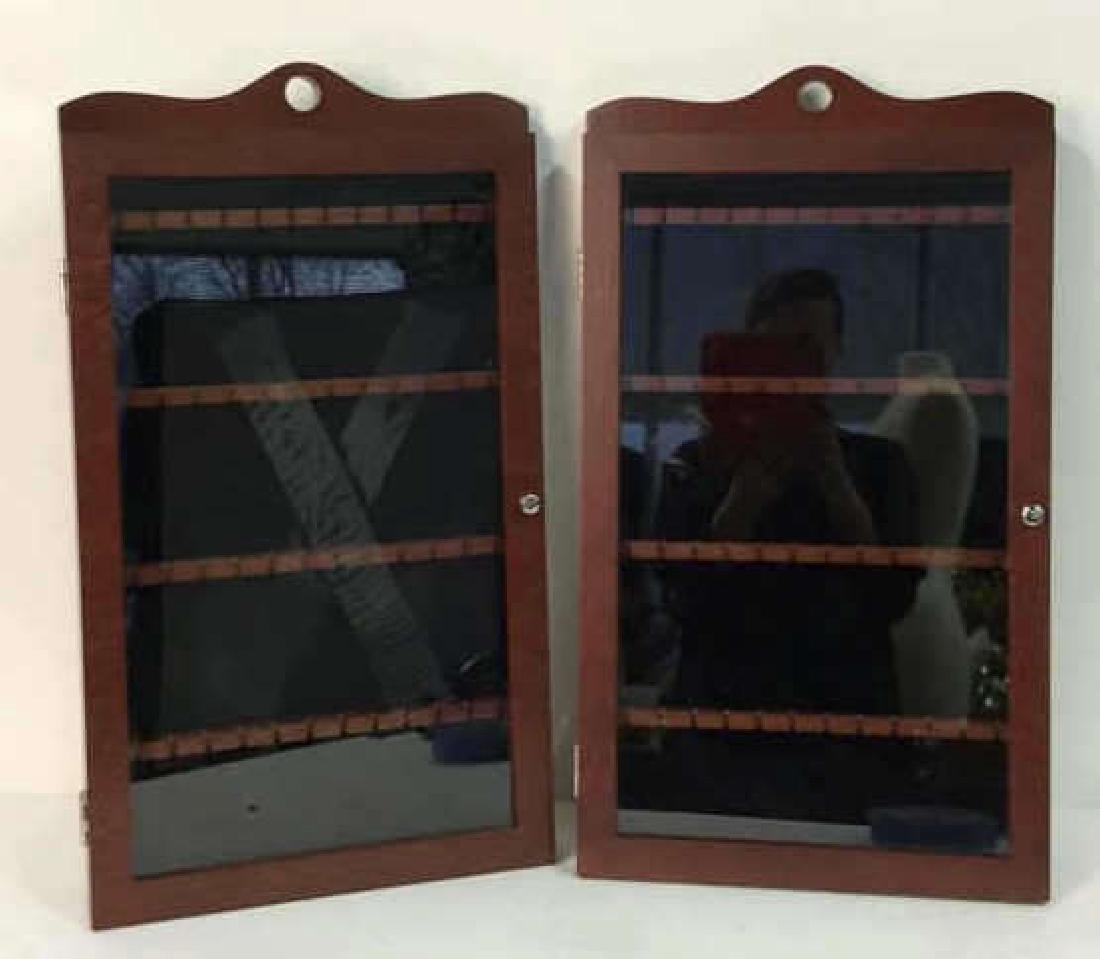 Pair LILIAN VERNON Spoon Cabinets: Pair LILIAN VERNON Spoon Cabinets. Matching wooden wall hanging spoon cabinet with glass front and silver toned metal handle on door. Marks on glass are leftover from shipping tape, is not damage. Bra
