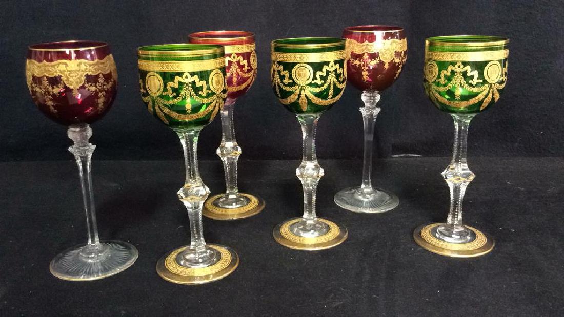 Set 6 Bohemia Cut Crystal Colored Wine Glasses: Set 6 Bohemia Cut Crystal Wine Glasses. Ornately decorated, green and cranberry toned crystal with clear geometric cut crystal stems. Decorated with possible gold leaf geometric, floral and lion head