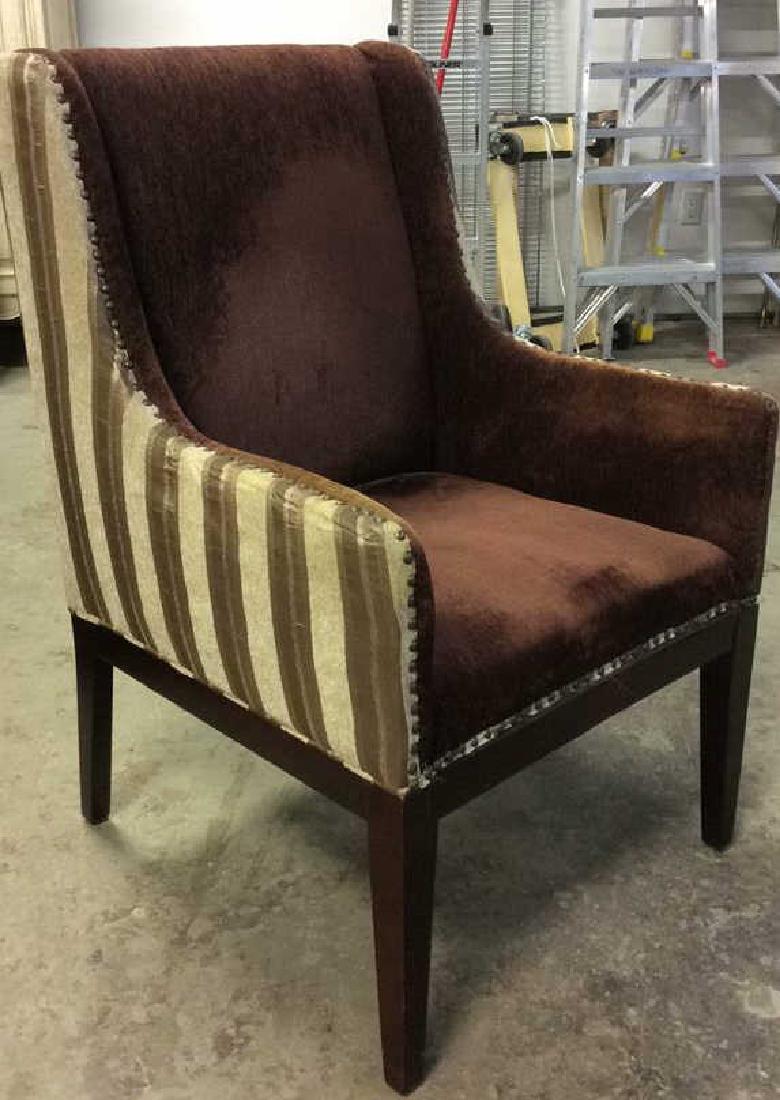 Multi Toned Wingback Striped Beaded Armchair: Upholstered arm chair, quasi wing chair, Contains stripes with tones of cream & brown. Inner portion of armchair has milk chocolate tone. Legs are wooden and dark brown toned. Contains beaded metal de